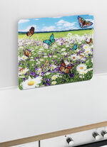 Wandpaneel van glas met zomerweidemotief 