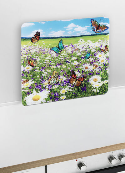 Wandpaneel van glas met zomerweidemotief 