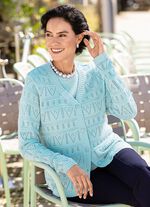 Gebreide twinset met opengewerkte accenten 