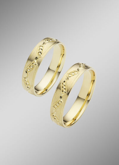 Gematteerde trouwring met stippenpatroon 