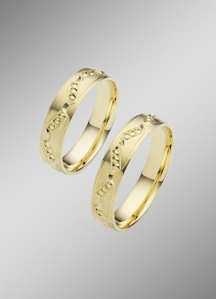 Gematteerde trouwring met stippenpatroon 