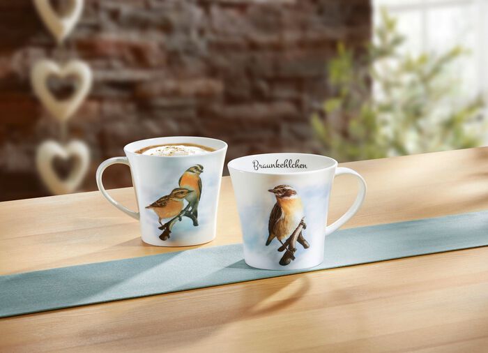 Mok met roodborsttapuitmotief 