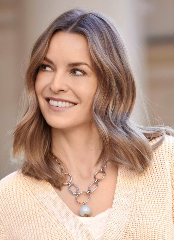 Schakelketting met een parelmoeren bol 