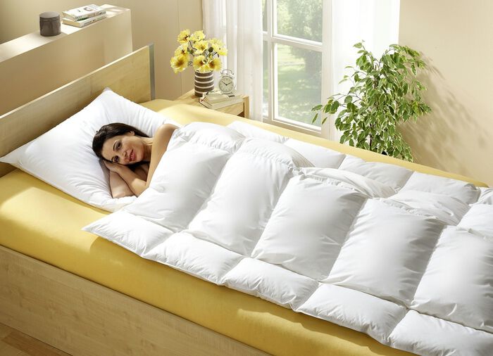 Knuffelig donzen dekbed in lichaamsvorm 