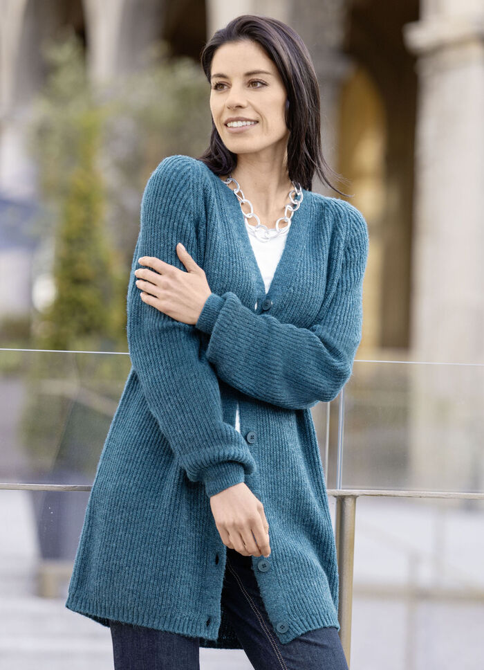 Lange cardigan met parelkwastje 