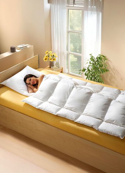 Knuffelig donzen dekbed in lichaamsvorm 