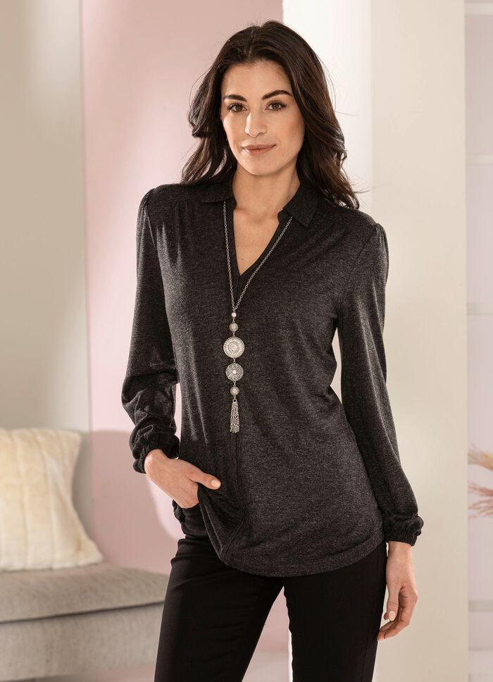 Poloshirt met ruches op de schouder 