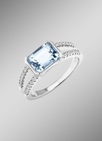 Elegantie ontmoet tijdloosheid: damesring met blauwe topaas en synthetische zirkonia 