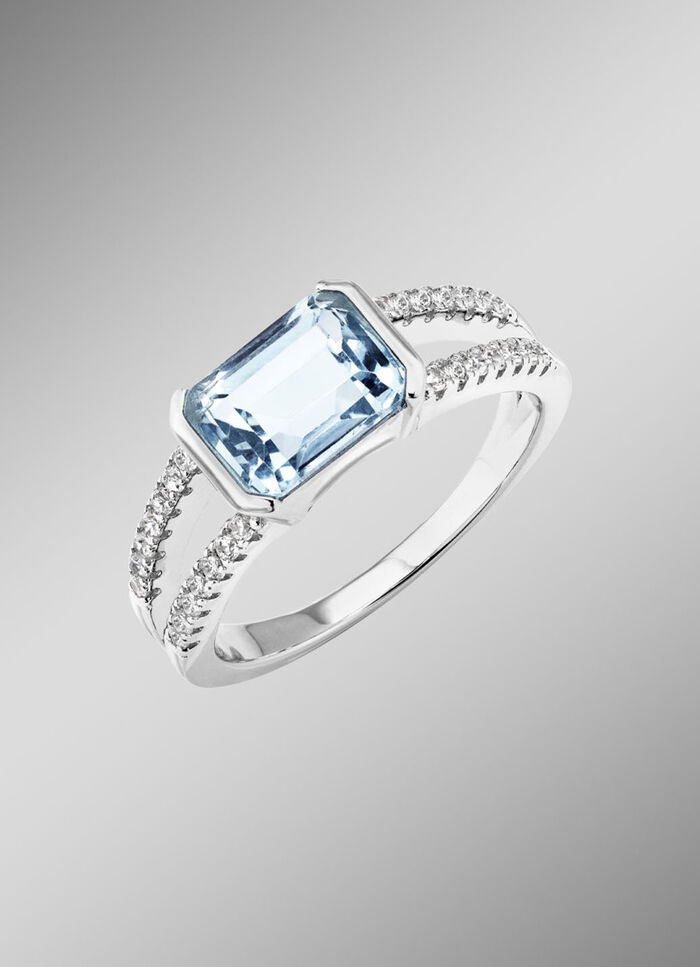 Elegantie ontmoet tijdloosheid: damesring met blauwe topaas en synthetische zirkonia 