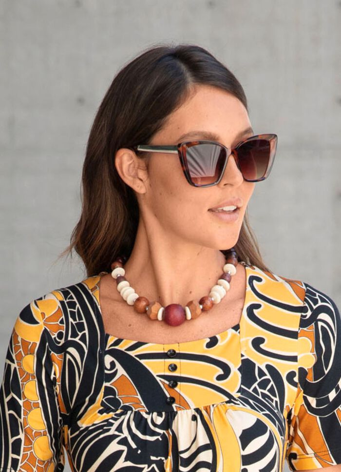 Halsketting met houten balletjes volgens cursus 