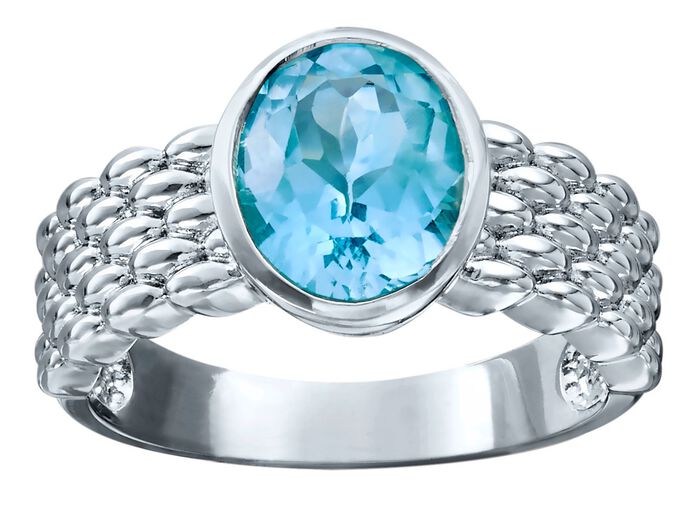 Damesring met blauwe topaas en ringband met structuur 