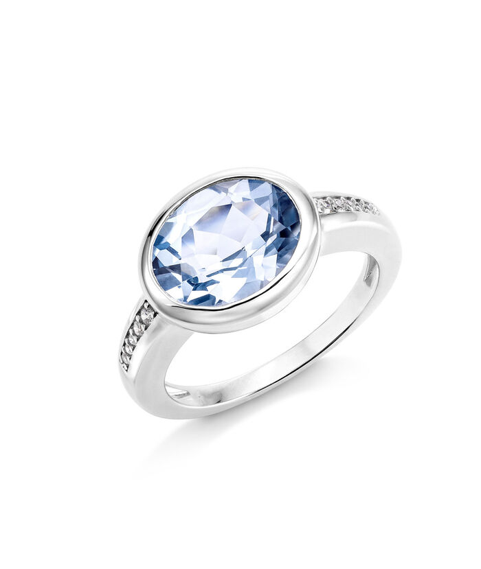 Chique damesring met bezel. Blauwe topaas en synthetisch. zirkonia 
