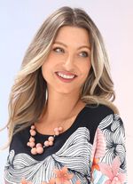 Mooie ketting met perzikkleurige bolletjes 