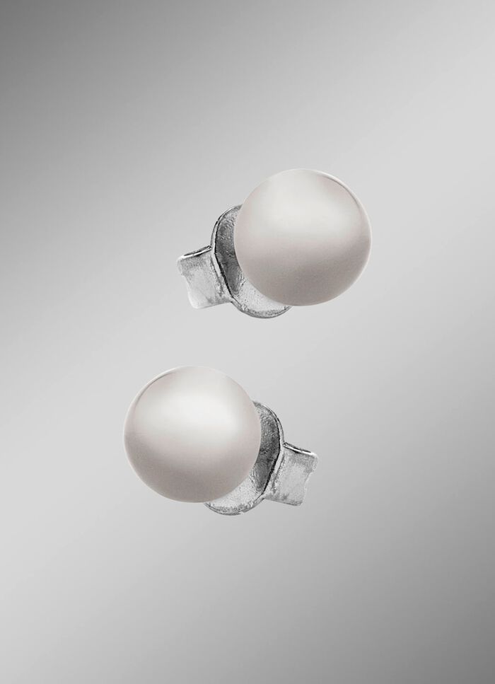 Kleine maar fijne bolvormige oorbellen van titanium 