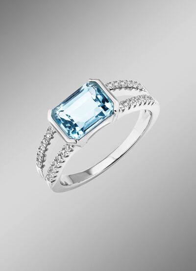 Elegantie ontmoet tijdloosheid: damesring met blauwe topaas en synthetische zirkonia 