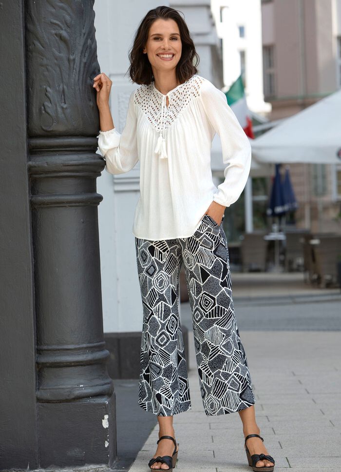 Tuniek met strikbandjes 